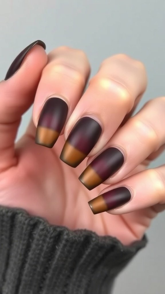 A hand showing matte brown ombre nails with glossy tips, featuring a cozy knitted sweater.